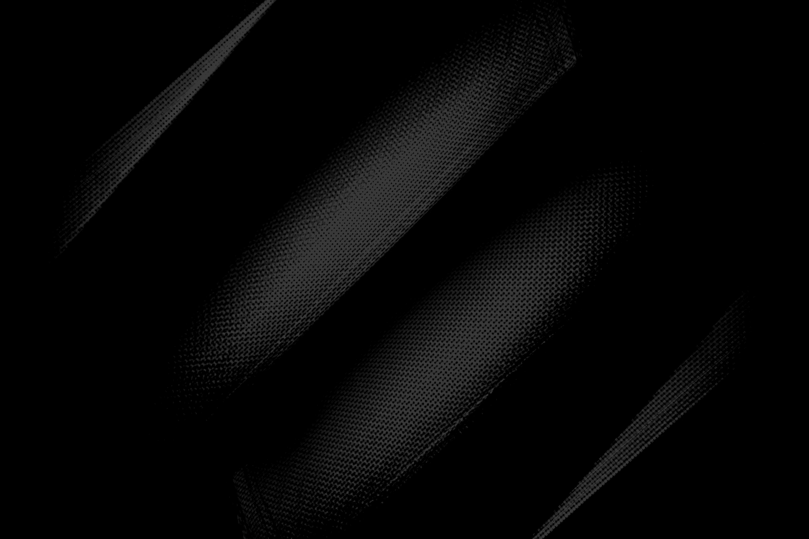 Abstract dark woven textile with diagonal folds and soft shadows